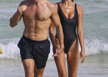 Taron Egerton looked Bond-ready as he strode out of the sea with his stunning girlfriend Brooks Nader on his arm amid his apparent bid to be named the next 007