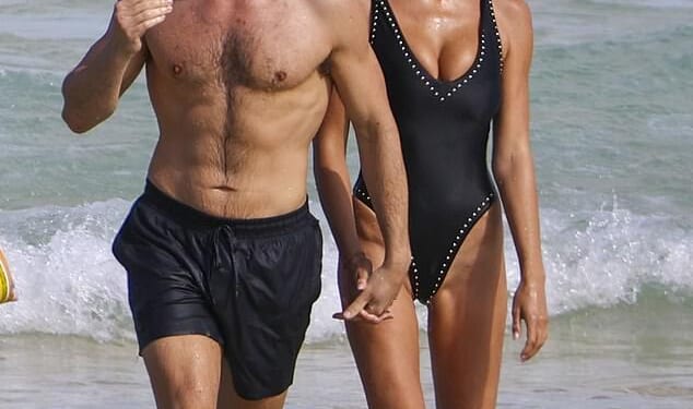 Taron Egerton looked Bond-ready as he strode out of the sea with his stunning girlfriend Brooks Nader on his arm amid his apparent bid to be named the next 007