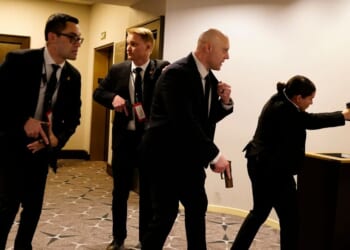 Federal agents with their guns drawn react to an incident that occurred at the annual White House Correspondents Association Dinner on April 25, 2026 in Washington, DC.