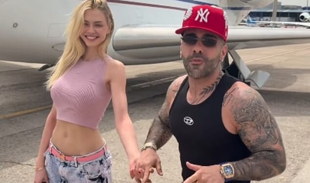 Influencer Sasha Sobhani, 38, the son of a senior Iranian official, has sparked outrage after flaunting his lavish lifestyle on social media, as millions of Iranians face war and ongoing oppression. Screen grab from a clip posted on his Instagram shows the 38-year-old is kissing the Spanish model – who carries a £25,000 Hermes Birkin bag