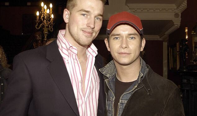 Stephen Gately widower Andrew Cowles (left) has announced he has received the all-clear from cancer 17 years after the Boyzone star's tragic death (pictured together in 2004)