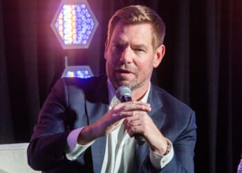 Then-Rep. Eric Swalwell of California, who resigned in disgrace Tuesday amid sexual assault allegations, is seen in a file photo from February, speaking at a California governor candidate forum in Los Angeles.