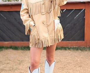 Sydney Sweeney, 28, was seen sitting on her boyfriend Scooter Braun's shoulders as the couple attended Stagecoach 2026 in Indio, California on Friday; seen on Friday at Stagecoach