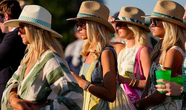 Patrons watch on the 17th hole during the third round of the Masters golf tournament at the Augusta National Golf Club, Saturday, April 11