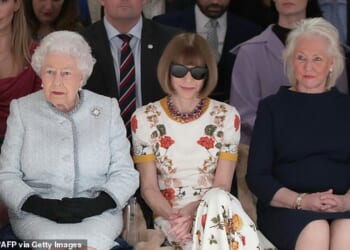 The Queen's dresser Angela Kelly (left) recalled how Elizabeth II would 'dance and sing' to ABBA as she paid a moving tribute to 'my best friend'. Ms Kelly is seen here with Elizabeth (left) and Vogue editor Anna Wintour during a show at London Fashion Week in 2018