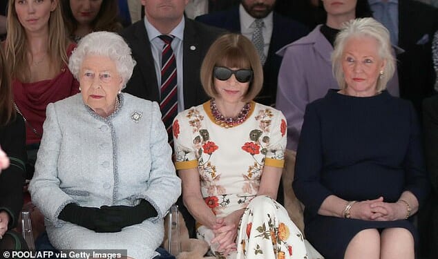 The Queen's dresser Angela Kelly (left) recalled how Elizabeth II would 'dance and sing' to ABBA as she paid a moving tribute to 'my best friend'. Ms Kelly is seen here with Elizabeth (left) and Vogue editor Anna Wintour during a show at London Fashion Week in 2018