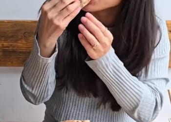 Dining out on sourdough pizza might be falling out of fashion and once-beloved chains, including Franco Manca and Mama Dough, shut stores (pictured: Food influencer @servedinlondon at Mama Dough)