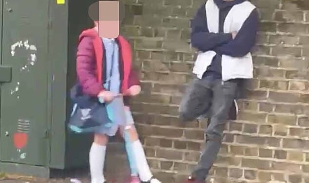 Police were called after tempers flared when parents challenged the man - who is in his early 20s and is believed to have mental health issues - who they claimed had been monitoring children outside Laleham Church of England Primary School in Surrey