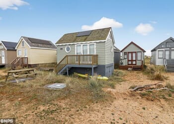 The 13ft by 9ft chalet offers undisturbed views of the harbour from its spot among 343 other huts on the the renownedly exclusive Mudeford Spit in Christchurch, Dorset