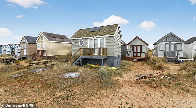The 13ft by 9ft chalet offers undisturbed views of the harbour from its spot among 343 other huts on the the renownedly exclusive Mudeford Spit in Christchurch, Dorset