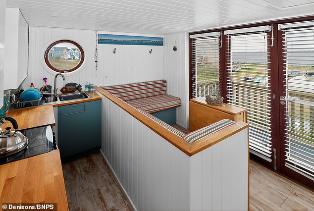 The panelled wooden cabin comes with an open plan kitchen, a bedroom and its own cellar - all of which can be snapped up for £325,000, despite only being able to use the hut seasonally