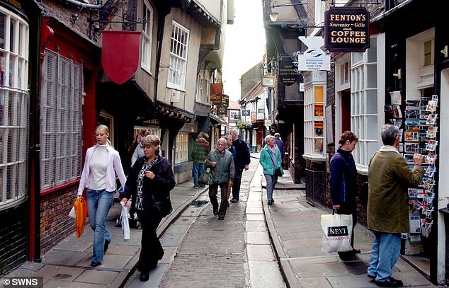 Residents living near The Shambles (pictured) in York say the 'historic gem' is now more akin to a replica of Diagon Alley, the fictional shopping district in J.K. Rowling's Hogwarts franchise