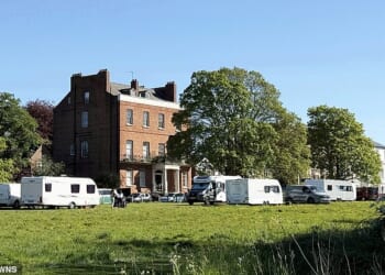 More than 20 caravans and motorhomes were moved on to parkland in the centre of Royal Leamington Spa, Warwickshire - just yards from the town's police station and £750,000 Regency homes