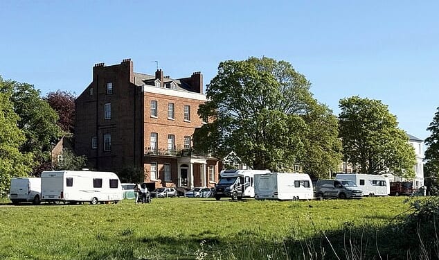 More than 20 caravans and motorhomes were moved on to parkland in the centre of Royal Leamington Spa, Warwickshire - just yards from the town's police station and £750,000 Regency homes