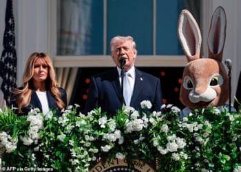 US President Donald Trump and First Lady Melania Trump address the crowd as they host the annual Easter Egg Roll on the South Lawn of the White House on April 6