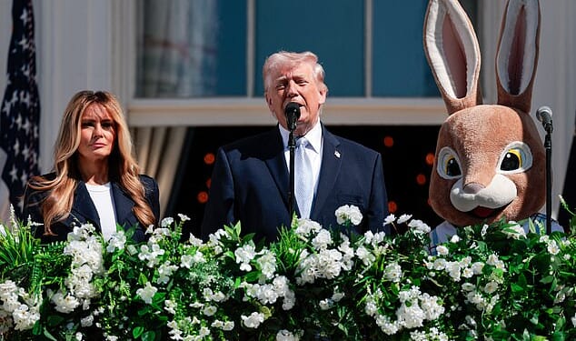 US President Donald Trump and First Lady Melania Trump address the crowd as they host the annual Easter Egg Roll on the South Lawn of the White House on April 6