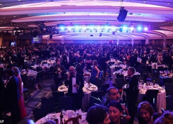 Guest evacuate after an incident at the White House Correspondents Dinner, Saturday, April 25, 2026, in Washington. (AP Photo/Tom Brenner)