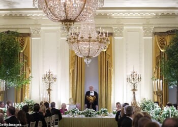 Amidst the floral elegance of a White House East Room transformed into a lush English garden, the evening's diplomatic focus shifted sharply toward global security