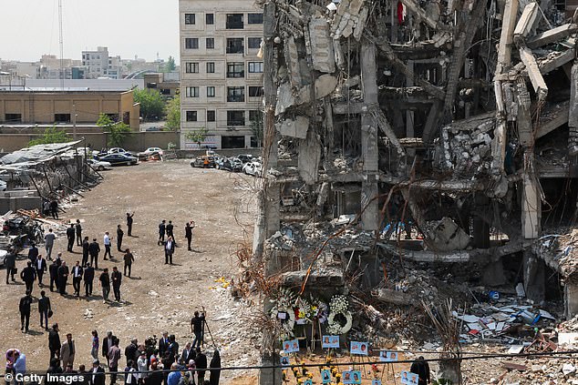 The current two-week long ceasefire in place will expire on 'Wednesday evening Washington time' (pictured: damage at sites in Tehran previously targeted by US-Israeli strikes)
