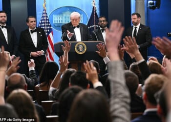 Most reporters had rushed over from the Hilton hotel which was hosting the dinner just over one mile away, with many still wearing their black tie and ball gowns from the ritzy gala