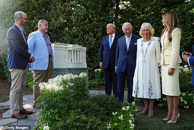 After the pictures were snapped, the group turned to head inside the White House's main residence for tea in the Green Room and a tour of the historic beehives on the South Lawn
