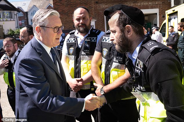 Sir Keir Starmer meets first responders from Shomrim North West London during a visit to Golders Green on April 30, 2026 following the attack