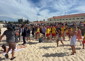 A Bondi sunbather appeared to be unaware that Harry and Meghan were just metres away