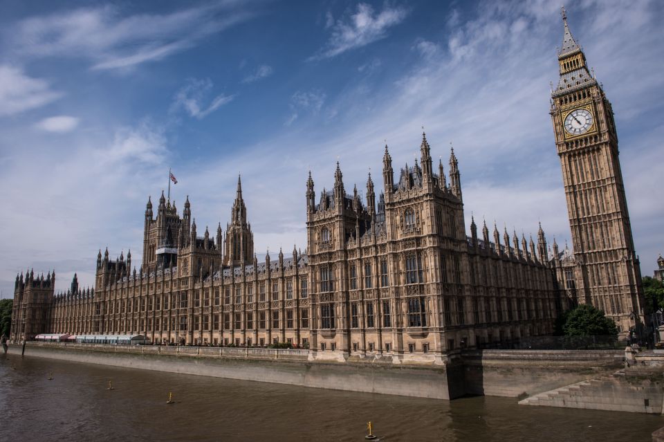 Palace of Westminster and Big Ben tower over the River Thames.