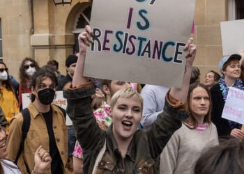 A year ago the Office for Students (OFS) fined the University of Sussex £585,000 for its treatment of gender-critical academic Kathleen Stock. Pictured: Students protesting at the Oxford Union