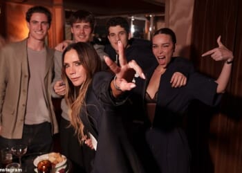 Victoria Beckham threw it back to her Spice Girls's heyday as she flashed the band's signature peace sign while at the launch of her new GAP range in New York