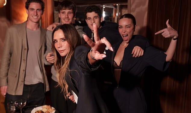 Victoria Beckham threw it back to her Spice Girls's heyday as she flashed the band's signature peace sign while at the launch of her new GAP range in New York