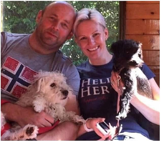 Aaron and Rebecca Thompson at home with jackapoo dogs PJ, left, and Pepsi, right