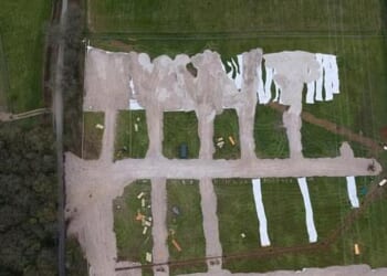 Villagers have been left furious after a group thought to be travellers barged their way onto a field near Friendless Lane in Hertfordshire and began laying down concrete (pictured)