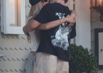 Taron Egerton and Brooks Nader (pictured) enjoyed a steamy and very public snog this weekend