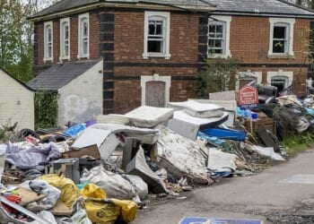 Fly-tippers have targeted former railway station near Dunmow in Essex (pictured) by dumping a five-foot wall of rubbish