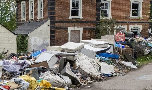 Fly-tippers have targeted former railway station near Dunmow in Essex (pictured) by dumping a five-foot wall of rubbish