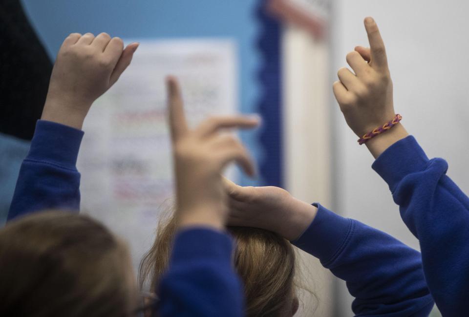 dated 27/11/19 of school children in a classroom. A teaching union is set to accuse the Scottish Government of a "complete abdication of responsibility" amid the lack of a national strategy on the physical restraint of pupils during classr