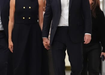 Pictured: Meghan wearing a black Karen Gee dress during a visit to the Royal Children's Hospital in Melbourne