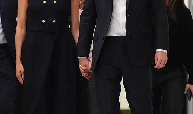 Pictured: Meghan wearing a black Karen Gee dress during a visit to the Royal Children's Hospital in Melbourne