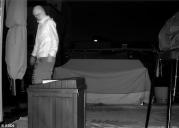 A masked figure was spotted climbing across the roofs of row houses in the dead of night