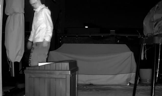 A masked figure was spotted climbing across the roofs of row houses in the dead of night
