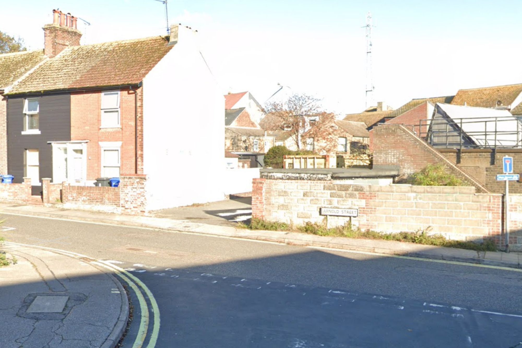 An image collage containing 1 images, Image 1 shows The intersection of Arnold Street and an alleyway in Lowestoft