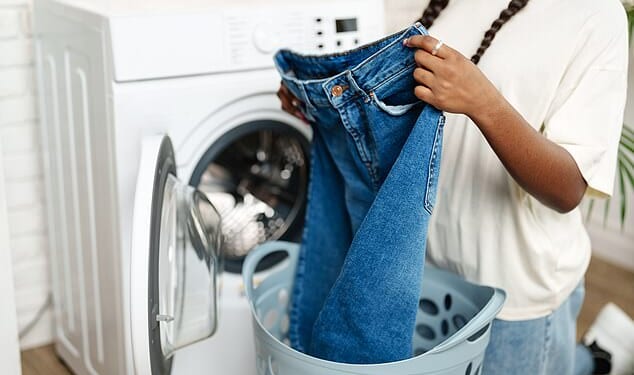 Experts from AO.com have revealed exactly how often common items need to be cleaned – including jeans (stock image)