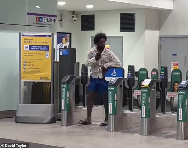 One of the men seen pushing through the barriers without paying at Romford station last night