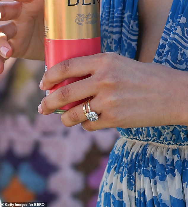 She was also seen sipping on a can of BERO as she displayed a gold wedding band and a glitzy engagement ring
