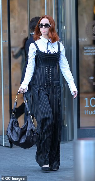 For those who are more fond of Emily Blunt's red-haired character Em, her white shirt and black corset aired with pinstriped trousers are also replicable in M&S' latest range