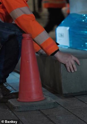 The video shows a close-up of red cones and lorry stablisters
