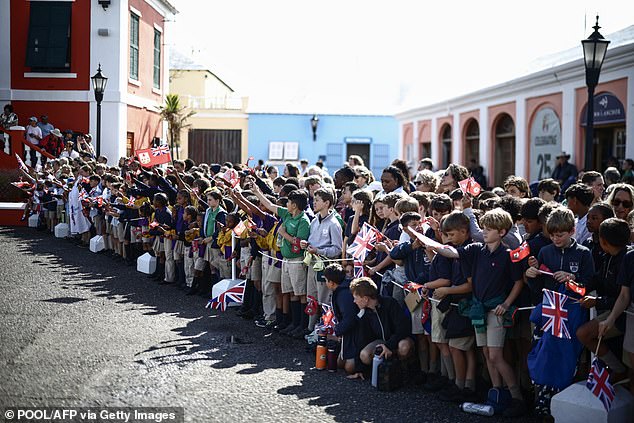 People wait for the arrival of King Charles III at King's Square in St George's, Bermuda, today