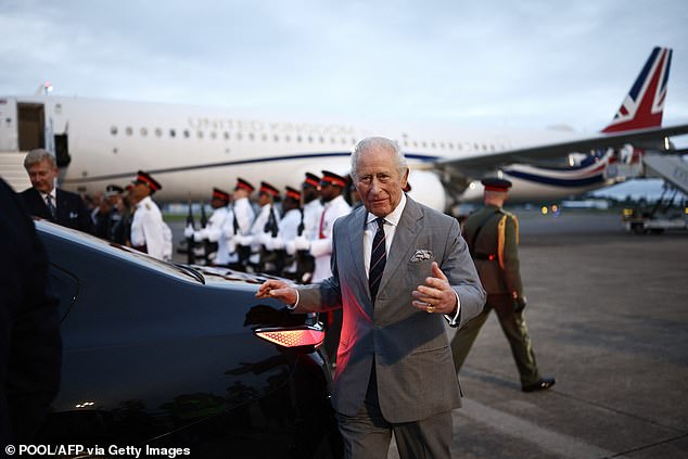 King Charles steps off a plane as he arrives for a ceremonial welcome in St George's, Bermuda