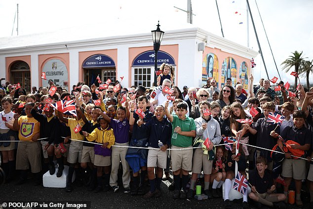 People wait for the arrival of King Charles III at King's Square in St George's, Bermuda, today